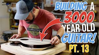 How To Build An Acoustic Guitar Episode 13 Gluing on the soundboard [upl. by Ardnuek]